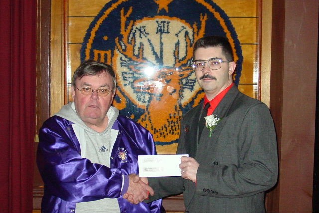February 2005 - Chief Taylor receives donation from Ken McGowan of the Potsdam Elks Lodge 2074