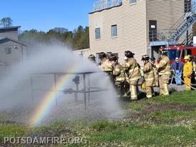 Members attacking a simulated gas fire